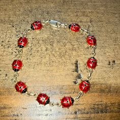 10k Yellow Gold & Enamel Italian Vintage Ladybug Bracelet Excellent Condition Adorable Enameled Ladybugs (10 In All) In Red And Black Set In Solid 10k Gold Hook And Clasp Closure Imprint Of Italy And 10k On Back 7” Length Sold As Is. *I Video Record The Condition And Packing Process As Documentation. No Returns And No Cancellations Once The Purchase Is Made. Adjustable Black Enamel Jewelry, Enamel Bracelet With Lobster Clasp, Enamel Bracelet Jewelry With Lobster Clasp, Nickel-free Enamel Bracelet As A Gift, Elegant Red Enamel Bracelets, Red Round Jewelry With Black Enamel, Red Enamel Collectible Jewelry, Collectible Enamel Bracelet Jewelry, Elegant Enamel Jewelry With Lobster Clasp