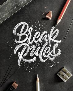 the words break the rules written in chalk on a black surface with pencils and crayons