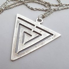 Huge matte antique silver triangle with a maze like pattern is suspended on an antique silver plated chain.  The big silver plated triangle measures just over 2 inches from top to bottom. The silver plated chain has a lobster clasp, and the length can be changed at no extra charge, please ask.  This necklace comes in a gift box. Also now available in matte gold plated, and bronze. More triangles here: http://etsy.me/2q3vhDj Sterling Silver Mood Ring, Gem Necklaces, Armor Stand, Triangle Jewelry, Art Nouveau Necklaces, Silver Diamond Necklace, Face Necklace, Metal Clay Jewelry, Triangle Necklace