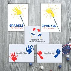 three cards with hand prints and sparklers on them