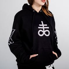 Crafted from 100% premium cotton, these hoodies offer unmatched comfort and durability. Each piece in this collection features our unique, provocative imagery, meticulously printed using the Direct-to-Garment (D.T.G) method for vibrant, long-lasting designs. Whether you’re making a bold statement or simply seeking everyday comfort, these hoodies are designed to stand out and express your individuality and make a powerful fashion statement. Material: 100% Premium Cotton Design: Unique Provocative Gothic Hooded Sweatshirt For Streetwear, Black Cotton Gothic Hoodie, Gothic Long Sleeve Cotton Hoodie, Gothic Hoodie With Graphic Print, Black Long Sleeve Sweatshirt With Band Logo, Black Hoodie With Band Logo, Cotton Hoodie With Band Logo, Powerful Fashion, Leviathan Cross