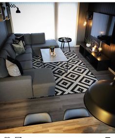 a modern living room with black and white decor