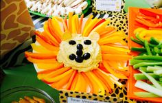 there are many different foods on display in the trays, including carrots and green beans