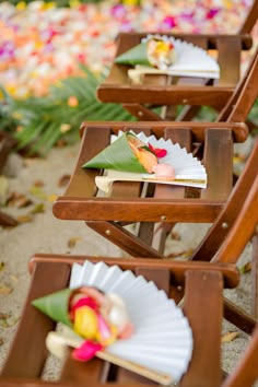 there are many small wooden trays with food on them that are lined up in rows