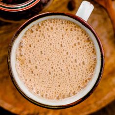 a close up of a cup of coffee on a table