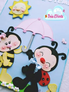 a close up of a paper cut out of two cartoon characters holding an open umbrella