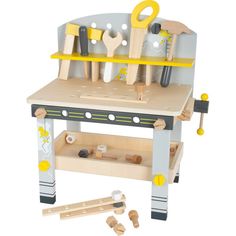 a wooden toy work bench with tools on it