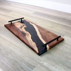 a wooden tray sitting on top of a hard wood floor