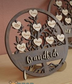 two wooden signs with hearts on them that say grandkids and the words i love you