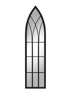 a black and white image of a gothic window