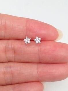 925 Sterling Silver Dainty Cz Star Stud Earrings - Metal: 925 Sterling Silver (Finish: Rhodium Plated) - Stone: Clear Cubic Zirconia, Round, Prong - Shape: Star  - Dimension: 4mm(0.16 in) x 1mm - Closure: Post at Above Center, Push Back - Color: Silver Sterling Silver Star-shaped Jewelry With Prong Setting, Sterling Silver Star Jewelry With Prong Setting, Diamond White Star Earrings For Anniversary, Star-shaped Sparkling Earrings For Anniversary, Sparkling Star-shaped Earrings For Anniversary, Star-shaped Hypoallergenic Jewelry For Anniversary, Hypoallergenic Star-shaped White Gold Jewelry, Hypoallergenic White Gold Star Jewelry, Star Stud Earrings