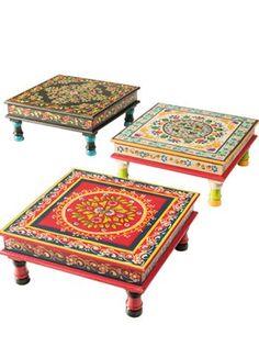 three tables with different designs on them