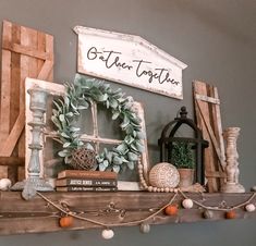 a shelf with some books and decorations on it