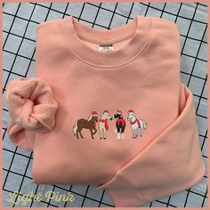 Christmas Horse Embroidery Sweatshirt, Christmas Embroidery Sweatshirt, Western Cowboy Christmas Embroidery Sweatshirt, Horse Lover Shirt NOTE: If you believe our product may infringe on any copyrights, please contact us directly so we can address the issue promptly. We kindly request that you refrain from reporting the issue until we have had a chance to resolve it. PRODUCT DESCRIPTION: *Sweatshirt - Material: 65% cotton, 35% polyester; polar fleece - Fit: Straight, side-stitched - Brand: AG (A Horse Embroidery, Sweatshirt Western, Christmas Horse, Christmas Horses, Side Stitch, Cowboy Christmas, Embroidery Sweatshirt, Sweatshirt Christmas, Christmas Embroidery