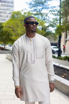 Premium Classic Kaftan Grey Long Sleeve Set Please select your size using the sizing chart below. Weight-Based Sizing Guide Grey Kaftan Men, Nigerian Clothes, General Clothes, Designer Kaftan, Kaftan Set, African Elegance, Nigerian Outfits, Costume Africain, African Shirts For Men