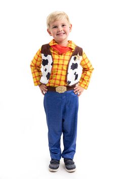 a young boy dressed up as toy story woody from the movie toy story, standing in front of a white background