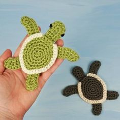 crocheted sea turtle and tortoise shell in hand