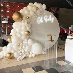 balloons and decorations are on display in an office lobby for the new baby arrival ceremony