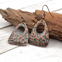 Long copper tone dangle earrings with beautiful hammered pattern.  The earrings full length is about 1.8" ( 45 mm ). These earrings can be made with ear wires ( like in the pictures ) or lever backs. ~ All items are beautifully packed ready to give as a gift and carefully wrapped up to ensure a safe delivery.  ~ The environment is very important for us therefore, in order to reduce waste, we will pack multiple items in one single package. If one of the pieces is intended as a gift, please leave Copper Drop Earrings For Festivals, Copper Drop Earrings For Festival, Bohemian Bronze Hypoallergenic Earrings, Bohemian Hypoallergenic Bronze Earrings, Hypoallergenic Bohemian Bronze Earrings, Copper Jewelry Handmade, Beachglass Jewelry, Earrings Teardrop, Mixed Metal Jewelry