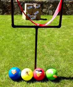 three balls are placed in the shape of a square on top of a metal stand