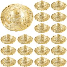 a large group of gold plates sitting next to each other on top of a white surface