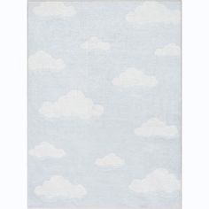 a blue rug with white clouds on it