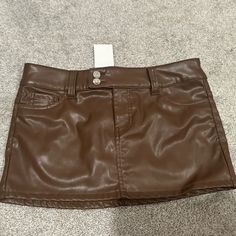 Mini Skirt, Never Worn And Still Tags Trendy Brown Mini Skirt For Night Out, Faux Leather Mini Skirt With Pockets, High Waist Mini Skirt By H&m, H&m Lined Mini Skirt For Fall, H&m Fall Lined Mini Skirt, Chic H&m Mini Skirt For Fall, Chic Brown Skort With Pockets, Brown Faux Leather Mini Skirt, Casual H&m Skirt For Night Out