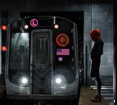 a person standing next to a subway train