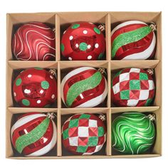 twelve red and green christmas ornaments in a box