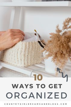 a basket with flowers and brushes in it on top of a shelf next to the words 10 ways to get organized