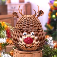 a wicker reindeer head sitting on top of a wooden box