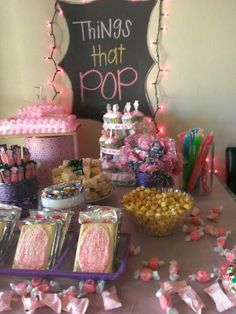 a table topped with lots of desserts and candy