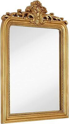 an ornate gold framed mirror on a white background