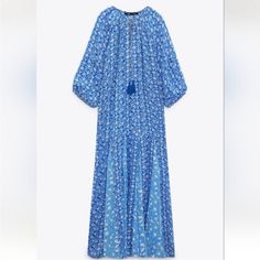 Chiffon Maxi Dress Pull Over Head With Front Tie With Tassels At The End Casual Blue Chiffon Maxi Dress, Blue Chiffon Dress For Beach, Breezy Long Sleeve Floral Print Dress, Blue Chiffon Summer Midi Dress, Blue Printed Dresses For Daywear, Blue Chiffon Midi Dress For The Beach, Blue Chiffon Midi Dress For Beach, Blue Long Dress For Spring, Breezy Blue Maxi Dress For Daywear