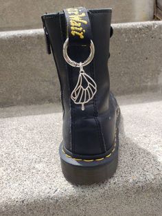 "This listing is for 1 ($9.00) single or a pair (2 for $17) butterfly fairy wing boot charm in silver tone with matching hardware. Charms are on a 0.7\" diameter ring clip. Butterfly fairy wing charms are ~1.55\" in length and ~1\" in width. These charms are perfect for the pullstrap/loop on the back of boots! A fun and spirited way to show off your style and strut with sass. Single charms are also great as key chains! ☆Check us out on Instagram and tiktok @MagpieMystics for product previews!☆" Grunge Fairy Wings, Butterfly Wing Boots, Fairy Grunge Backpack, Fairy Grunge Butterfly, Fairy Style Jewelry With Butterfly Charm For Gift, Boot Charms, Butterfly Fairy Wings, Grunge Boots, Wing Boots