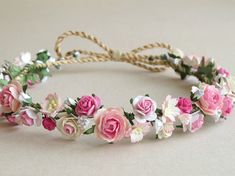 a headband with pink and white flowers on it