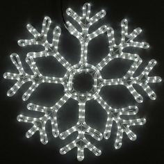 a snowflake with white lights on it