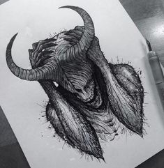 a drawing of an animal's head on paper