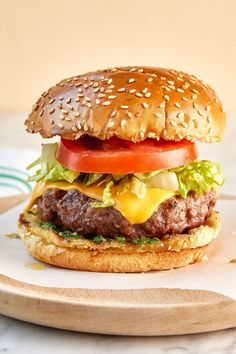 a hamburger with lettuce tomato and cheese