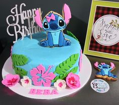 a birthday cake decorated with an image of stitch