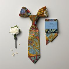 Look dashing, yet whimsical in this tie inspired by William Morris, the godfather of Arts and Crafts. It's like Downton Abbey met Woodstock and they both agreed: "This tie rocks!"

This tie features a meticulously crafted pattern inspired by the great William Morris, one of the leading figures of the Arts and Crafts Movement. Adorned with a stunning Hibiscus and Rose Mallow design, the tie is a nod to the vintage illustrations that dominated the Victorian era. Imagine yourself in a top hat and t Adjustable Multicolor Neckwear For Gift, Multicolor Tie With Pocket Square, Multicolor Ties With Pocket Square, Multicolor Neckwear As A Gift, Multicolor Suit And Tie Accessories With Pocket Square, Dapper Ties As Gifts, Dapper Standard Ties For Gift, Multicolor Standard Tie For Father's Day, Dapper Standard Ties As Gifts