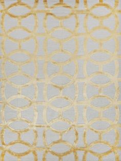 a white and gold rug with circles on it