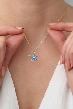 Small Gifts With Each Order!    ✨ PENDANT Blue Zircon Camellia Flower Necklace, Lotus Necklace, Valentine's Day Gift Details: * High-Quality Solid 925 Sterling Silver * Nickel free Measurements: *Chain length: Adjustable from 40 to 45 cm / 15.7 in to 17.7 in ✨ SHIPPING All the orders will be shipped to the shipping address supplied through your Etsy Order. Please check this address is correct before finishing your check out. Artgenie Jewelry is not responsible for packages shipped to wrong addre Blue Snowflake Sterling Silver Necklace, Blue Clavicle Chain Necklace As A Gift For Her, Sapphire Flower Jewelry For Gifts, Blue Flower-shaped Jewelry With Flower Charm, Blue Flower Shaped Jewelry For Anniversary, Blue Flower-shaped Jewelry For Anniversary, Light Blue Flower-shaped Jewelry For Gifts, Blue Round Necklace For Mother's Day, Light Blue Flower Shaped Jewelry Gift