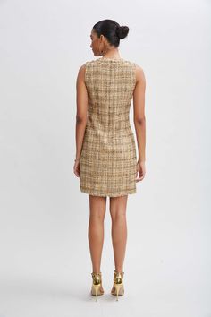 Go all in on the metallic trend in our Italian Tweed Dress. The luxe texture and patina of the weave lend a sophistication to Elie's modern take on the shift dress. Fringe details the sporty crest button front & pockets. Perfect for desk to dinner. Elie Tahari Exclusive Metallic Tweed Button Dress 49% Cotton, 27% Acrylic, 10% Polyester, 7% Poly Metallic, 4% Poly Amid, 3% Other Fiber Runs true to Size Length From Shoulder to Hem: Back 35.25"L (approx. length for size 6) Model is 5'9" and wearing The Shift, Long Sleeve Short Dress, Tweed Dress, Elie Tahari, Button Dress, Knit Tees, Denim Coat, Gold Dress, Knit Jacket