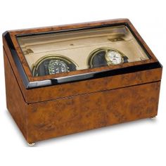 a wooden box with two clocks inside of it