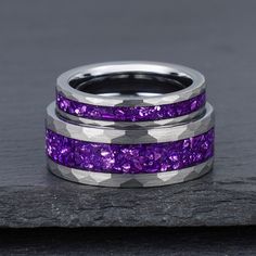 two wedding bands with purple glitter inlays