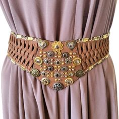 Vintage wide waist braided women's belt. Made of genuine leather in milk brown and metal details. 5 holes, hook fastening Size S Dimensions - 33.8''/86cm long end to end 29''/74cm long to the first hole 33''/84cm long to the last hole 4''/10cm wide /max/ Very good condition. Brown Leather Corset Belt For Festivals, Brown Leather Corset Belt With Removable Belt, Adjustable Brown Corset Belt With Matching Belt, Adjustable Corset Belt With Belt Loops For Festivals, Adjustable Corset Belt For Festivals, Leather Corset Belt For Festivals, Vintage Brown Corset Belt For Festivals, Adjustable Brown Belt For Festival, Adjustable Brown Belts For Festival