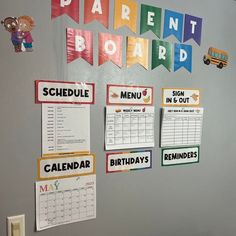 a bulletin board with school calendars and magnets attached to it's wall