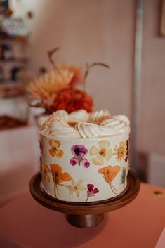 a decorated cake sitting on top of a table