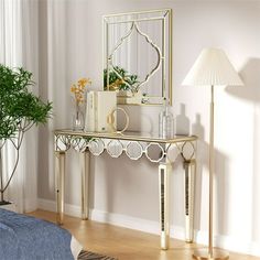 a living room scene with focus on the console table and lamp in the foreground